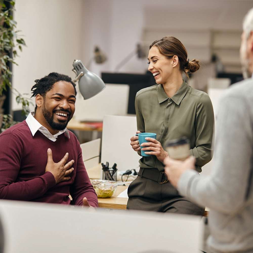 Co-workers having a happy chat.
